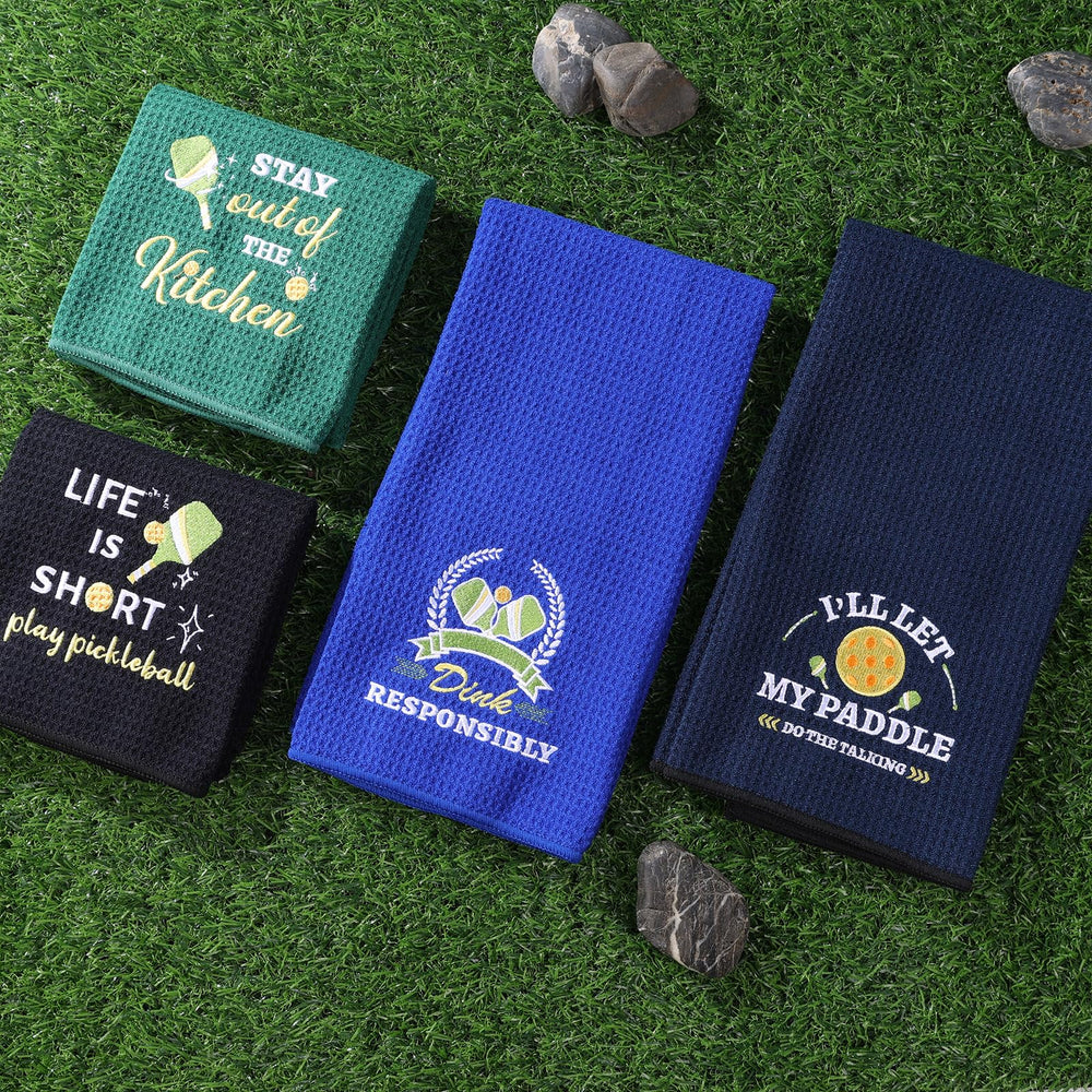 TLY towel next to paddle showing 24x16 inch size for practical use