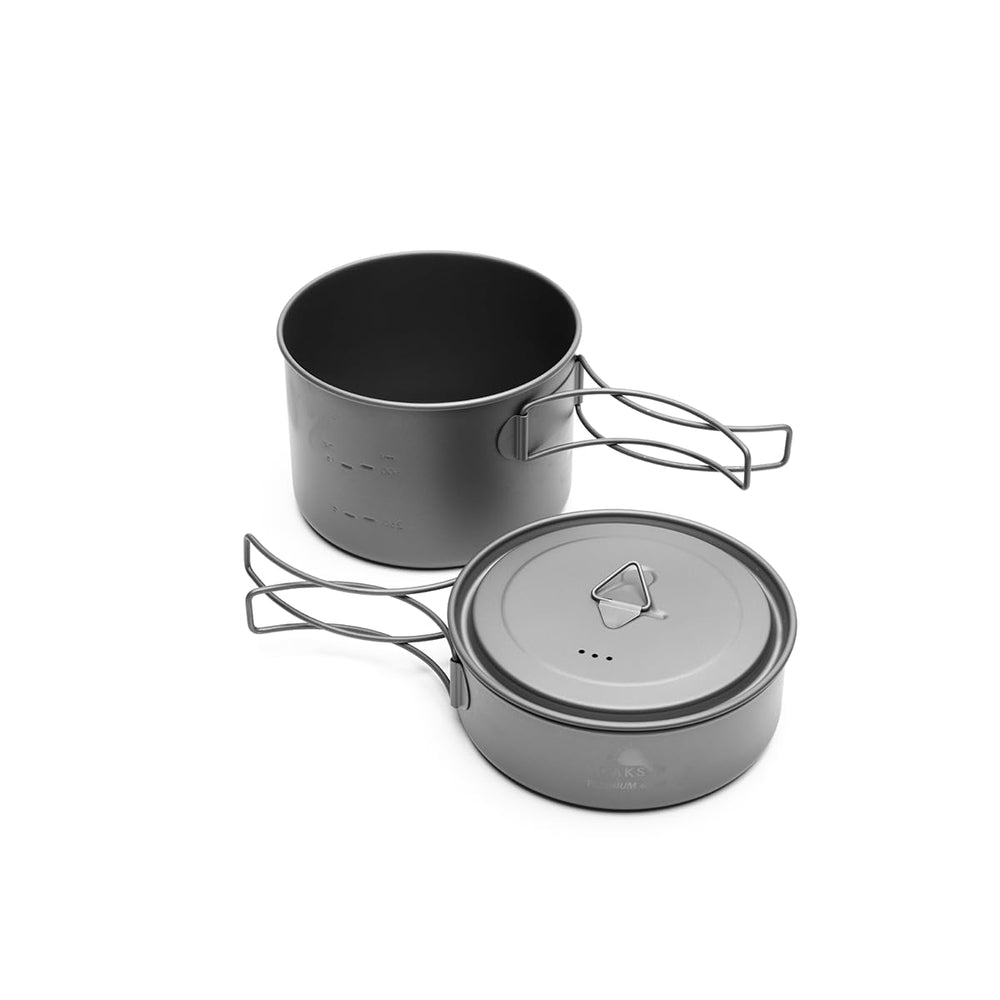 TOAKS cookset in use over stove illustrating fast boiling and serving