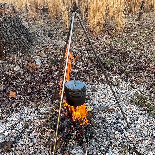 TOAKS pot being used over an open fire showing durable heat performance