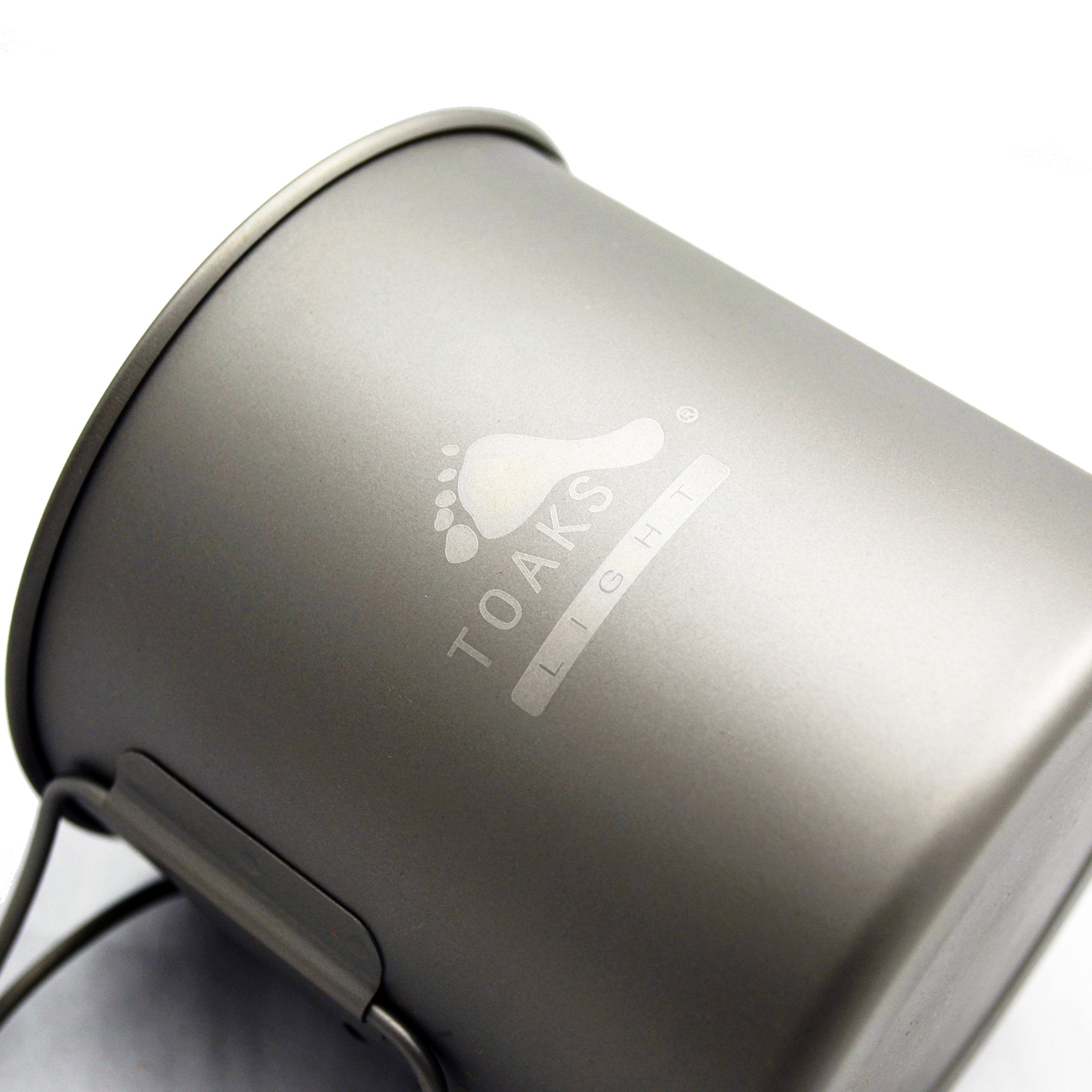 TOAKS titanium pot boiling water on a backpacking stove for quick meals