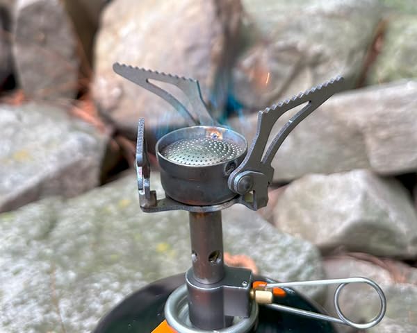 TOAKS titanium stove in use cooking on a pot demonstrating stable heat delivery