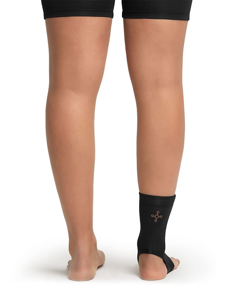 Tommie Copper sleeve worn on ankle during walk showing active support