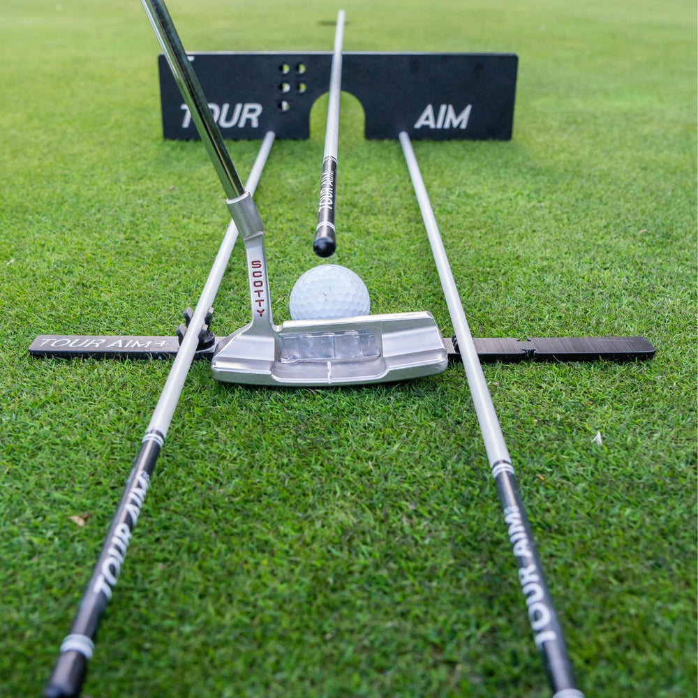 Tour Aim next to a driver for scale showing compact training portability