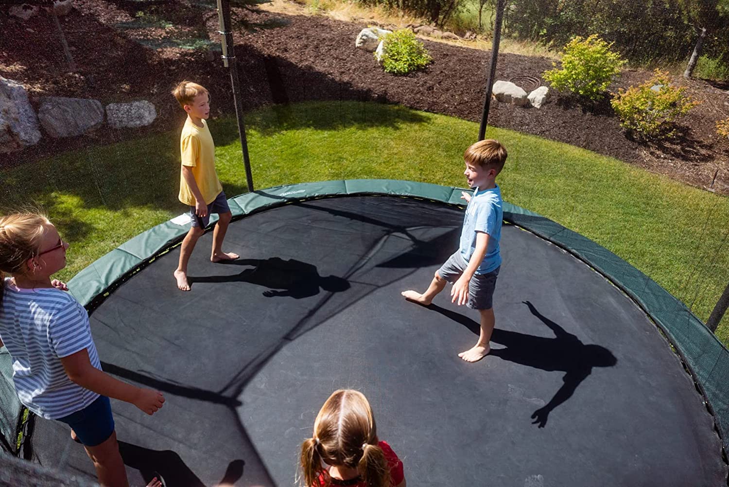 Trampoline Pro mat next to tape measure showing 159 inch diameter fit