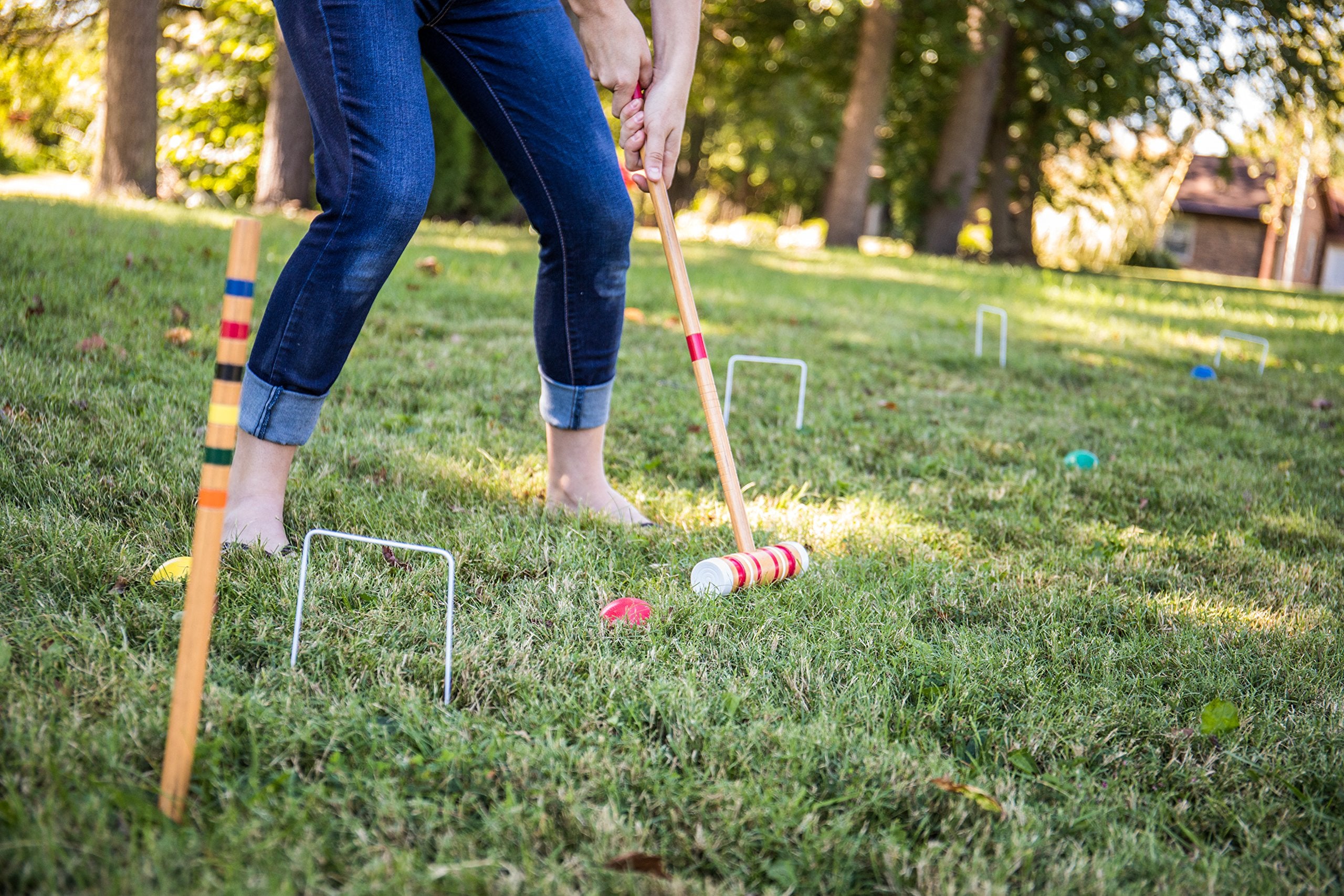 Triumph Sports croquet set in backyard use showing group play and social outdoor fun