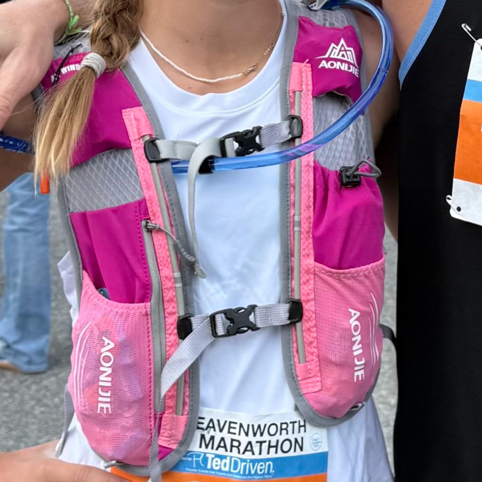 TRIWONDER vest worn by trail runner showing secure low-bounce fit advantage