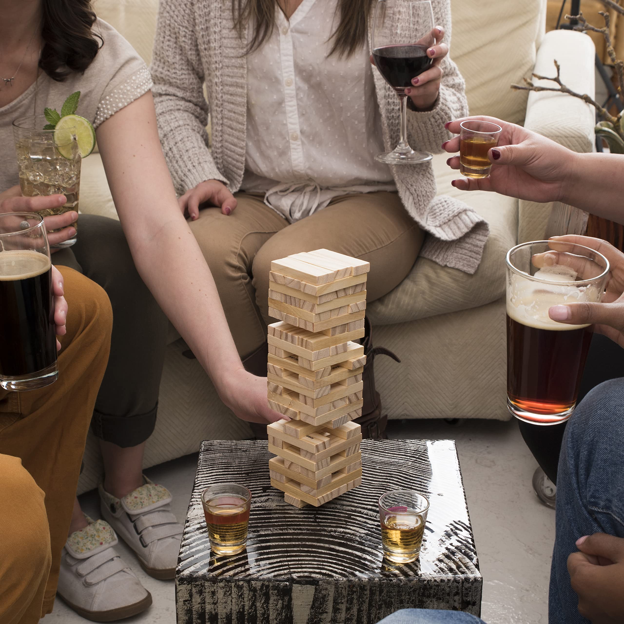 True hands removing a block demonstrating steady play and party tension