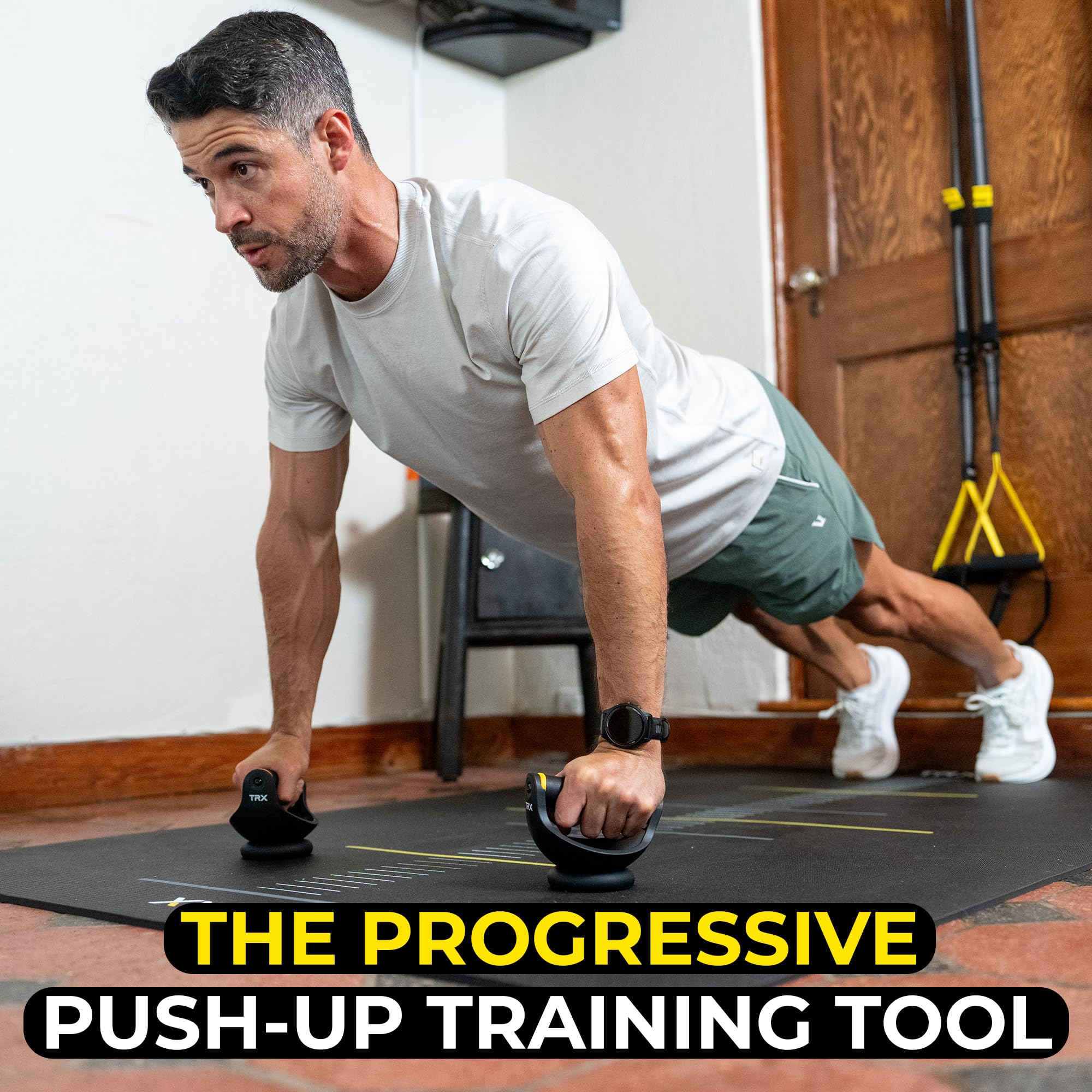 TRX Push-It side angle illustrating handle rotation for natural arm movement benefit