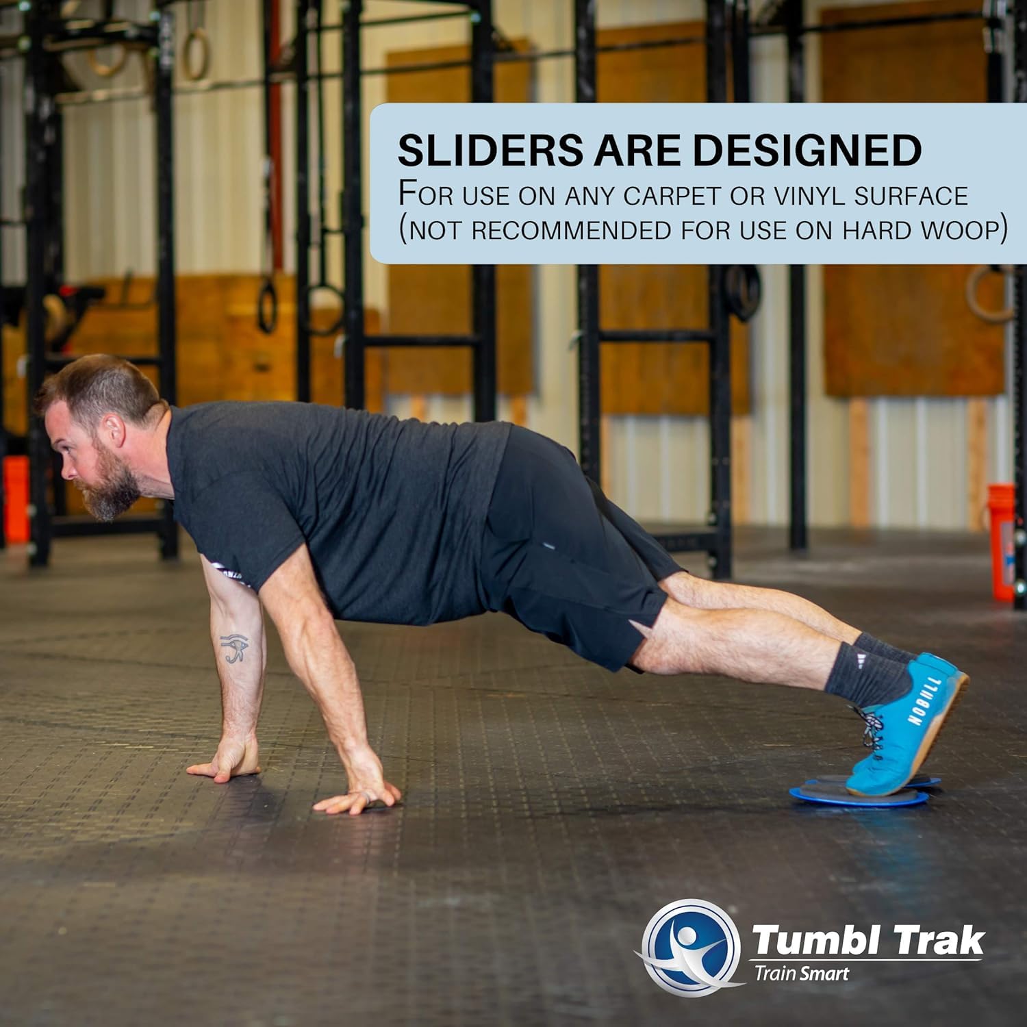 Tumbl Trak in use under hand during plank showing reduced joint pressure