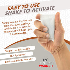 Tundras warmer next to hand for scale showing compact portable size