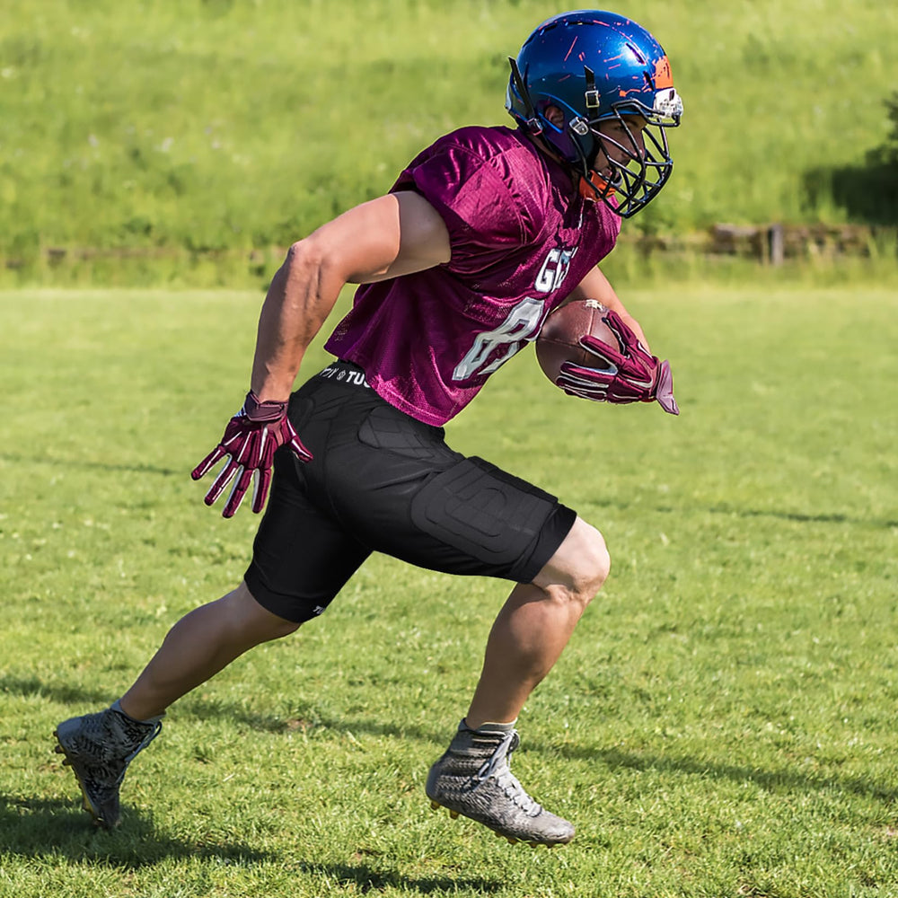 TUOYR athlete in football slide demonstrating impact protection in play