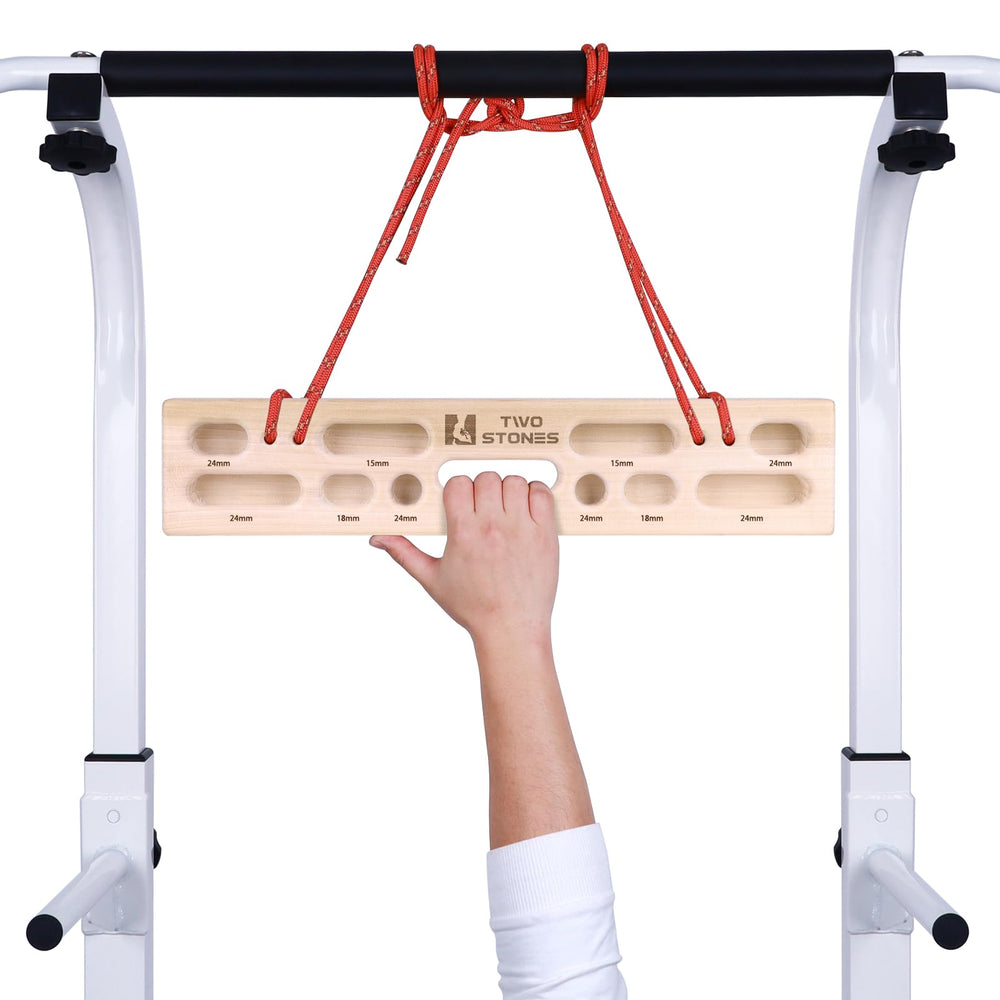 Two Stones hangboard scale with hand to show size and portability benefit