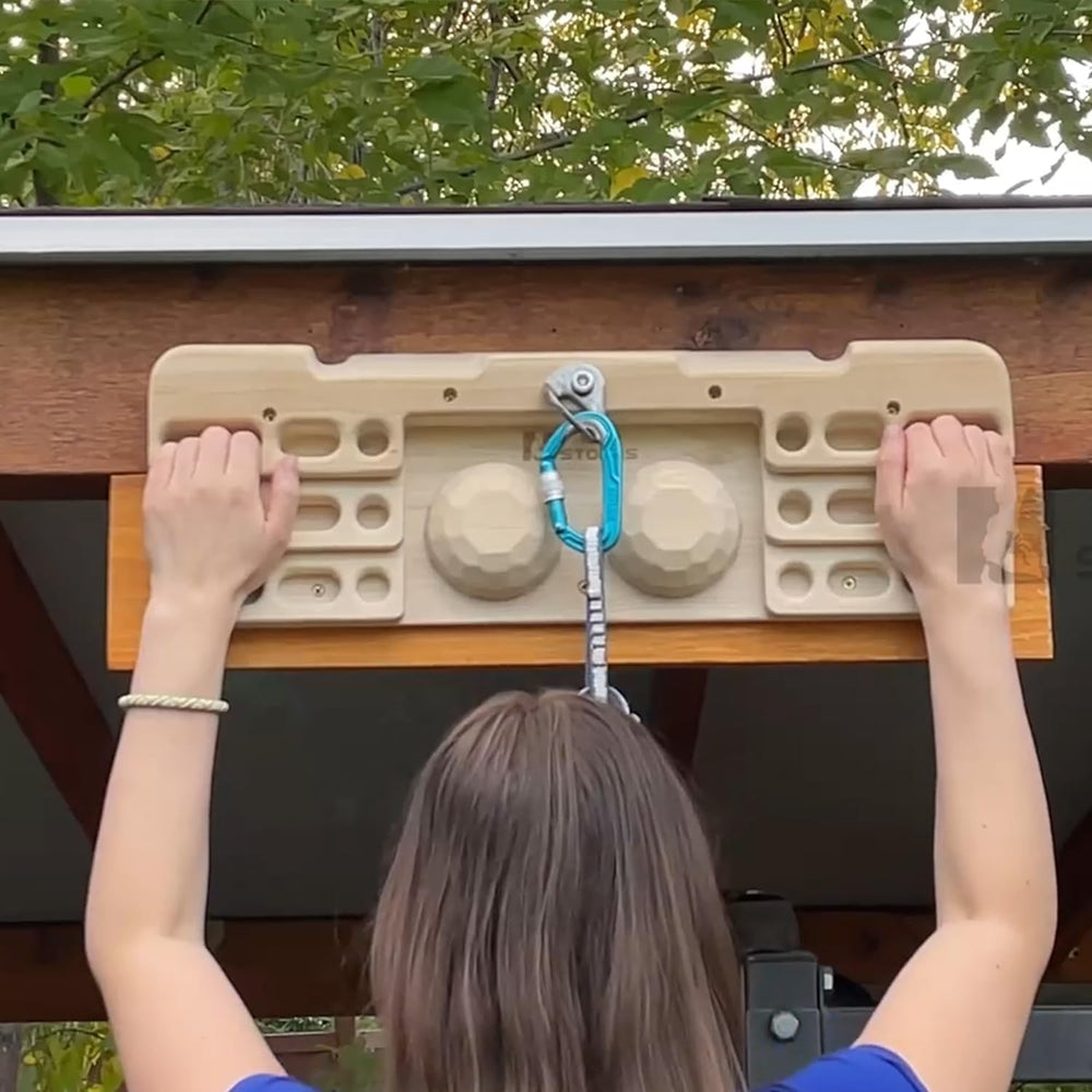 TWO STONES athlete using the hangboard in a home training setup showing effective workout benefit