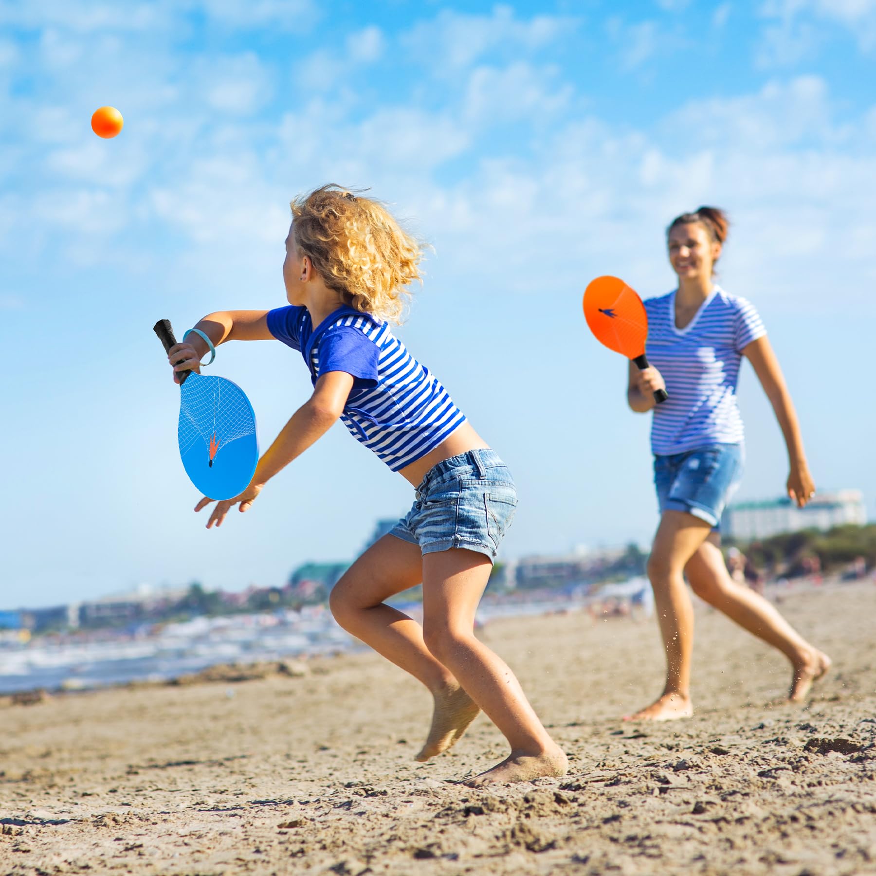 U&C Planet family playing on beach demonstrating fun, active outdoor entertainment