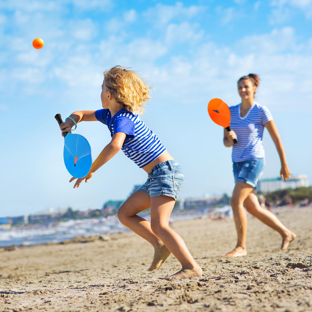 U&C Planet family playing on beach demonstrating fun, active outdoor entertainment
