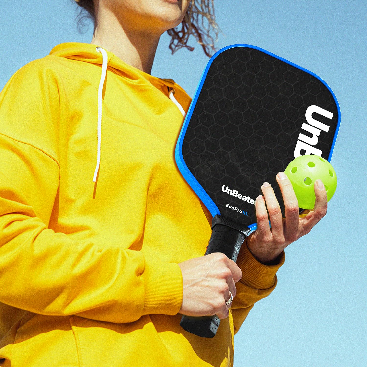 UNB10 paddles on court in play showing balanced feel and spin performance