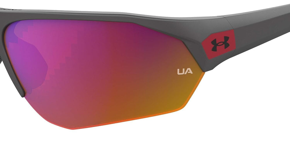 Under Armour side profile on child model showing secure fit during activity benefit performance