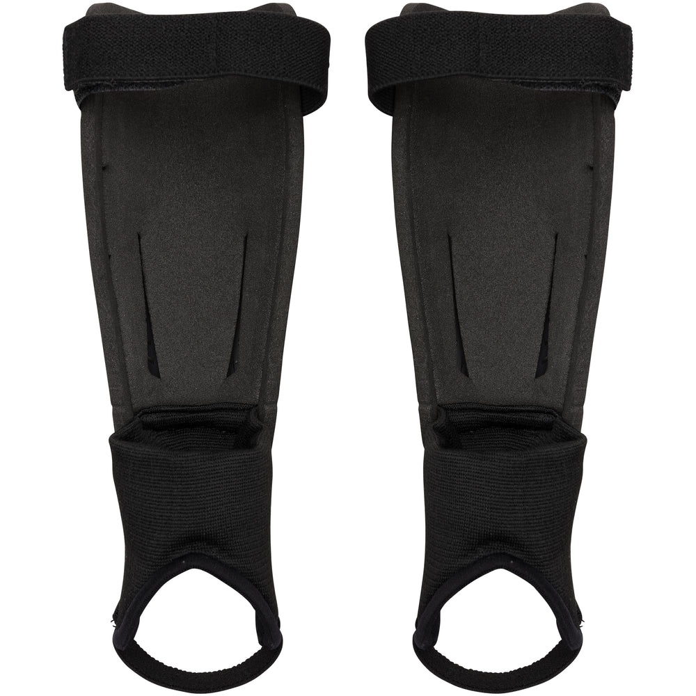Under Armour shin guard worn by youth player demonstrating ankle disc protection