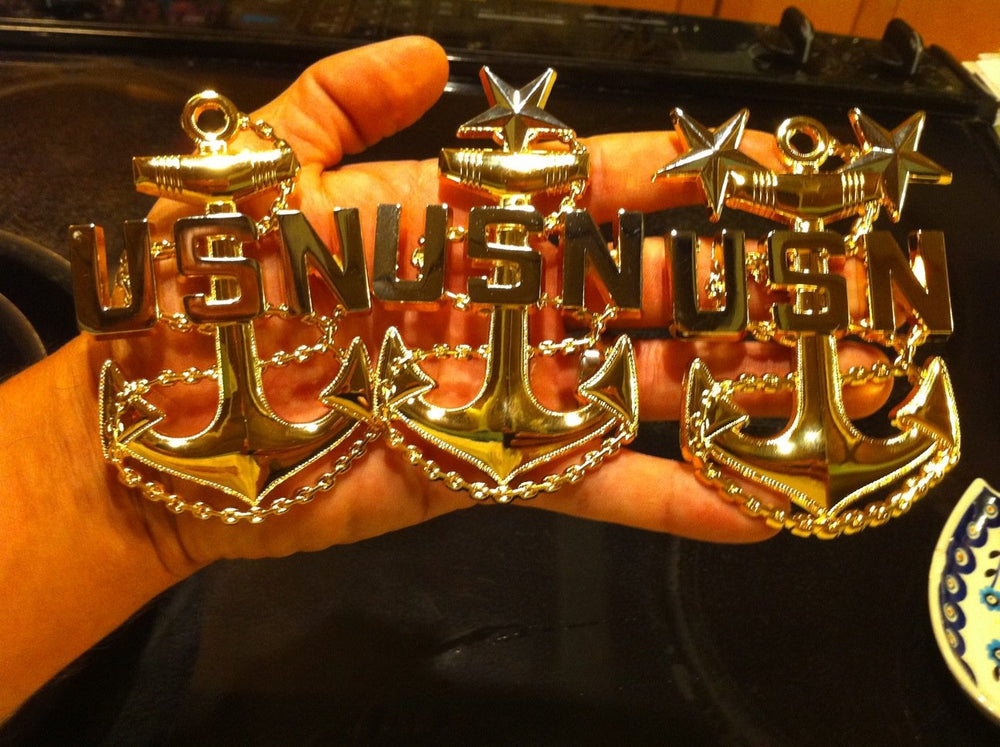 Unknown brand anchor mounted on uniform demonstrating proper placement and presentation