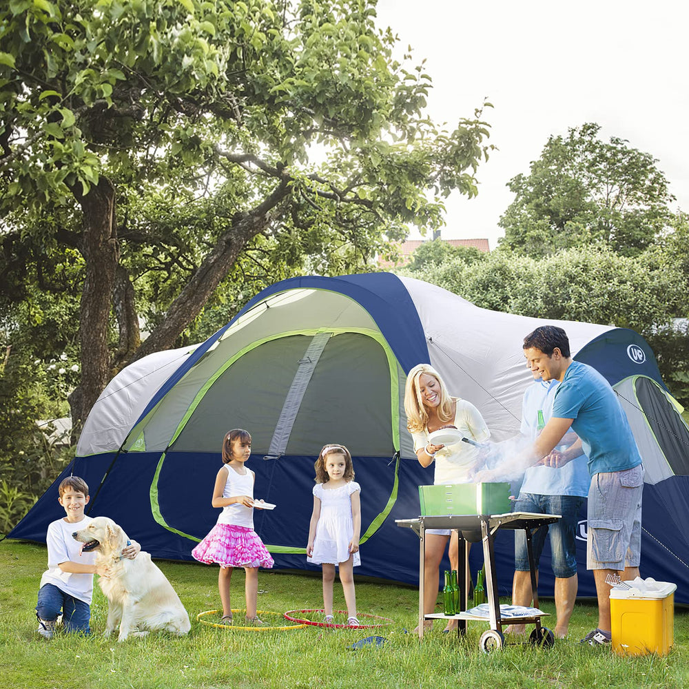UNP family sitting outside tent at dusk illustrating comfortable group camping