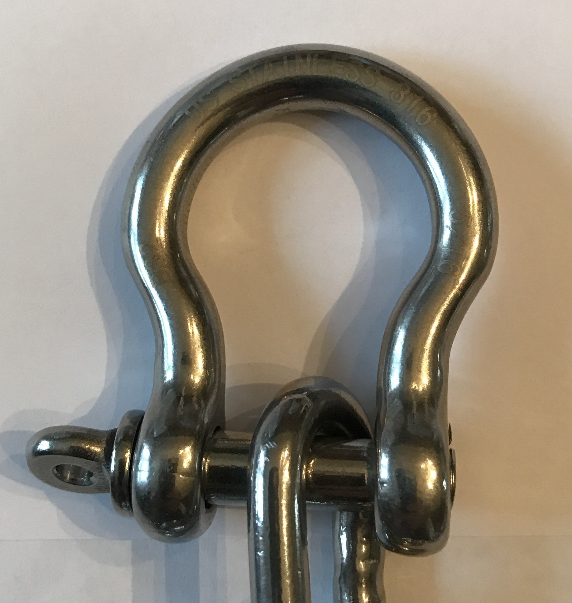 US Stainless chain laid beside ruler showing 4-foot length accuracy