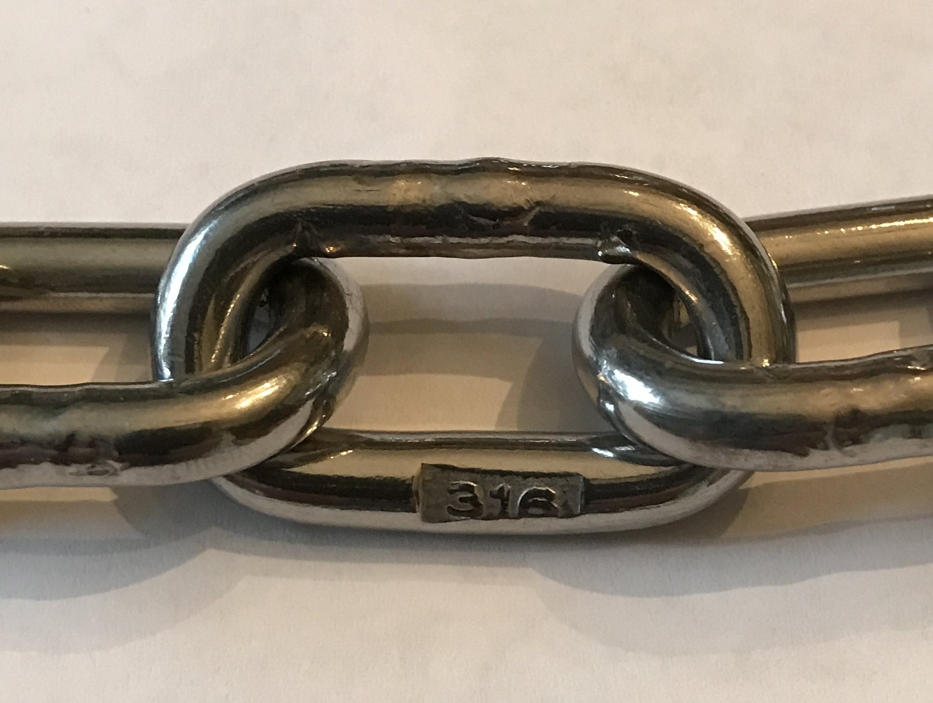 US Stainless chain installed on a bow roller demonstrating ready use