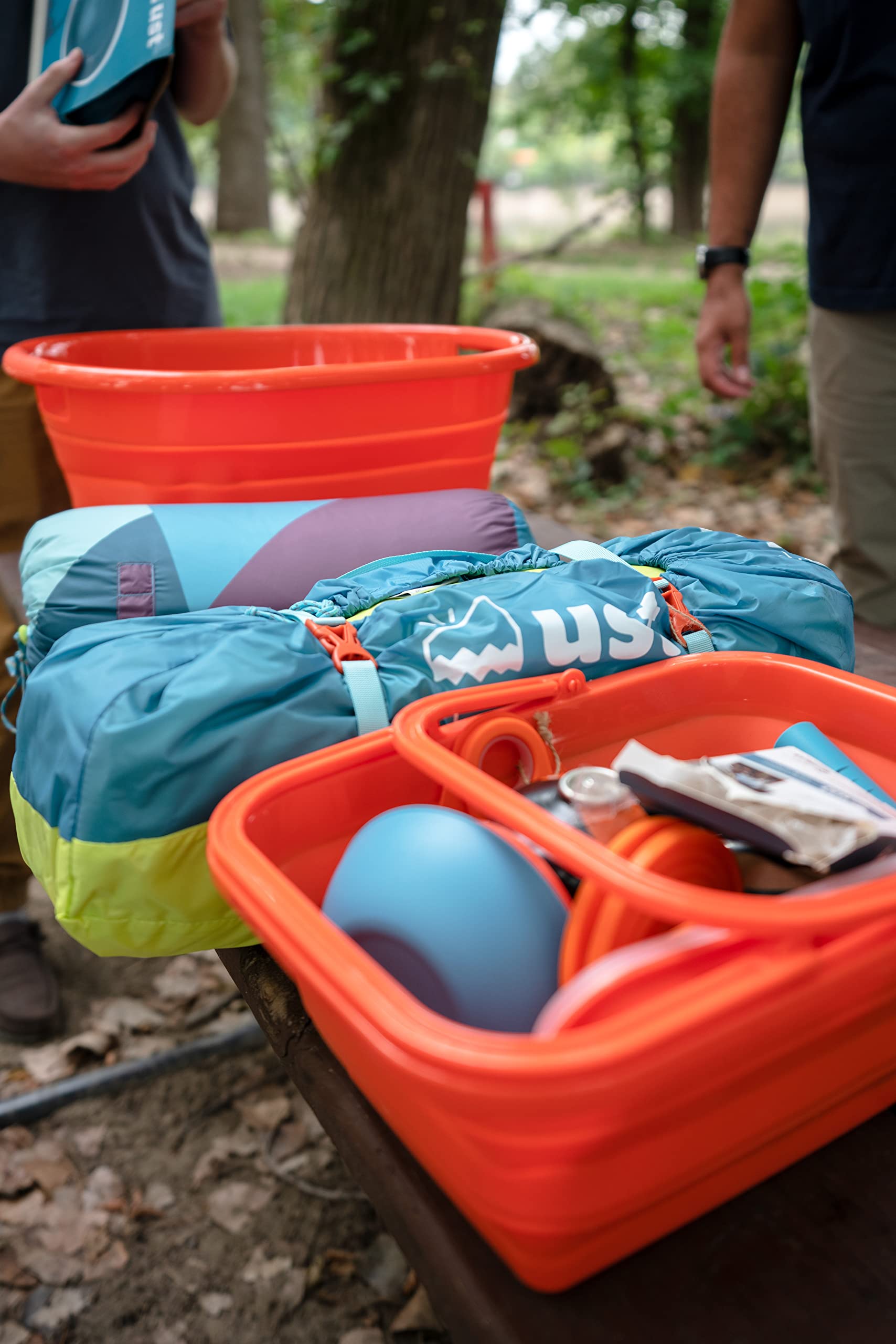 ust FlexWare sink size comparison next to camping gear demonstrating portable scale