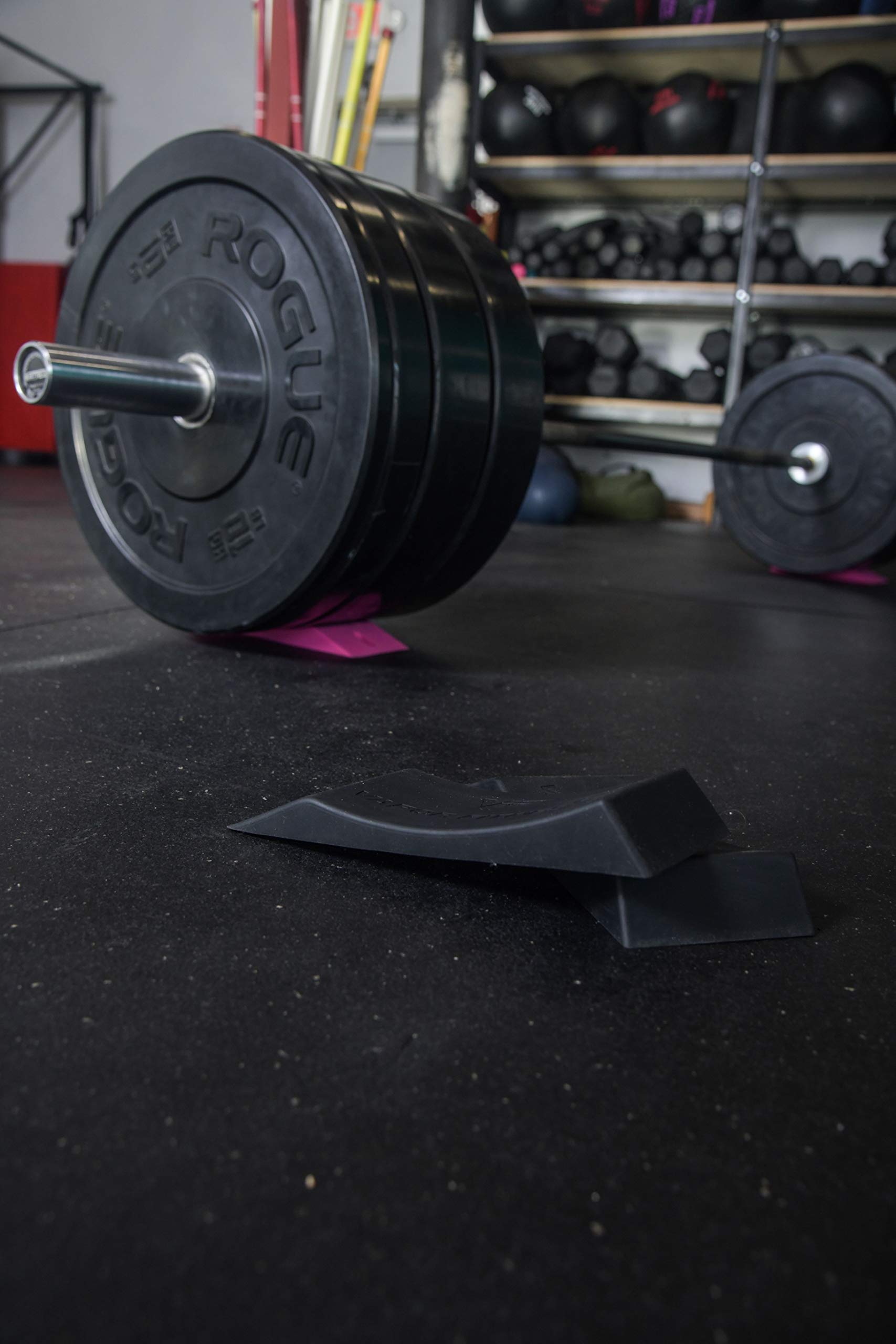 Vapor Fitness pair hung on a gym hook for tidy storage and quick access
