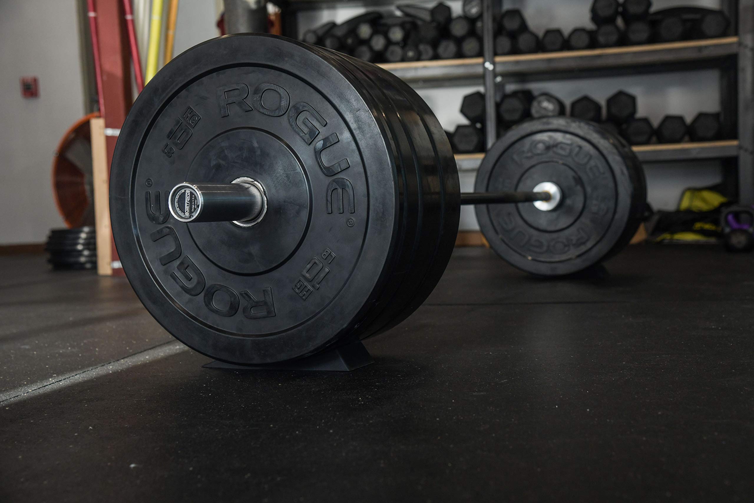 Vapor Fitness wedge positioned under barbell keeps bar steady during loading