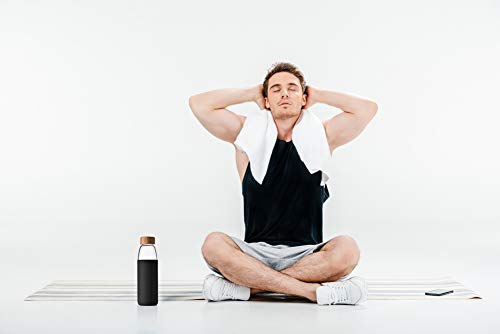 veegoal bottle on desk and gym bag showing everyday lifestyle use