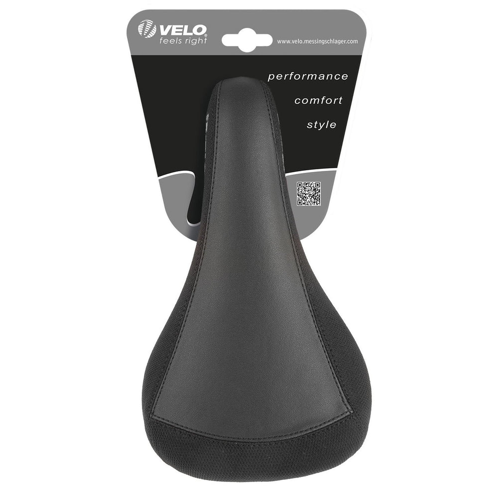 VELO saddle next to ruler showing 247x137mm size for precise fit benefit