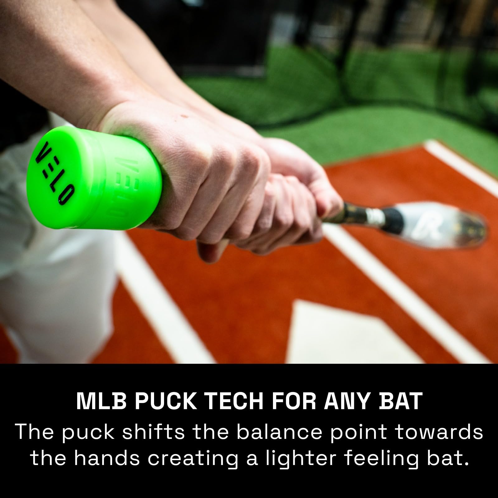 VELO Sports puck beside bat and bag showing portable training benefit