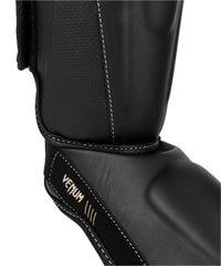 Venum Impact Evo close-up of tibia reinforcement showing structured protection