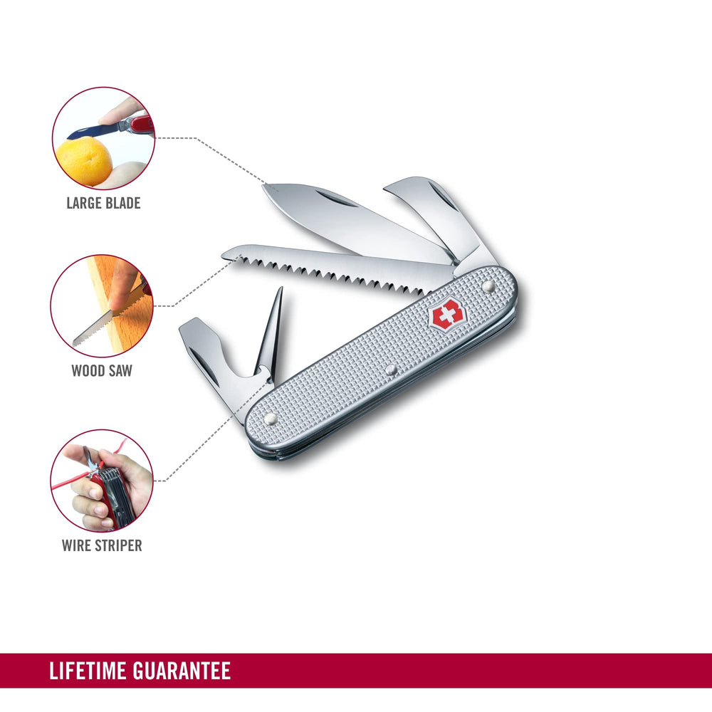 Victorinox Alox in use sawing small branch to show outdoor cutting capability