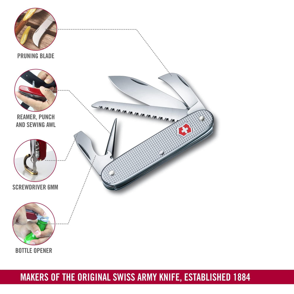 Victorinox Alox next to hand and keys to show pocket-friendly scale