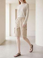 VtuAOL thigh flap pocket close-up showing button closure security
