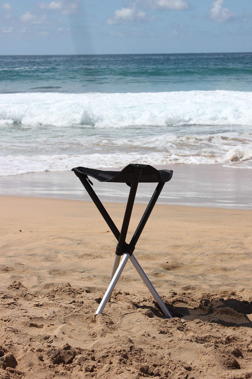 Walkstool next to backpack showing scale and travel-friendly size benefit