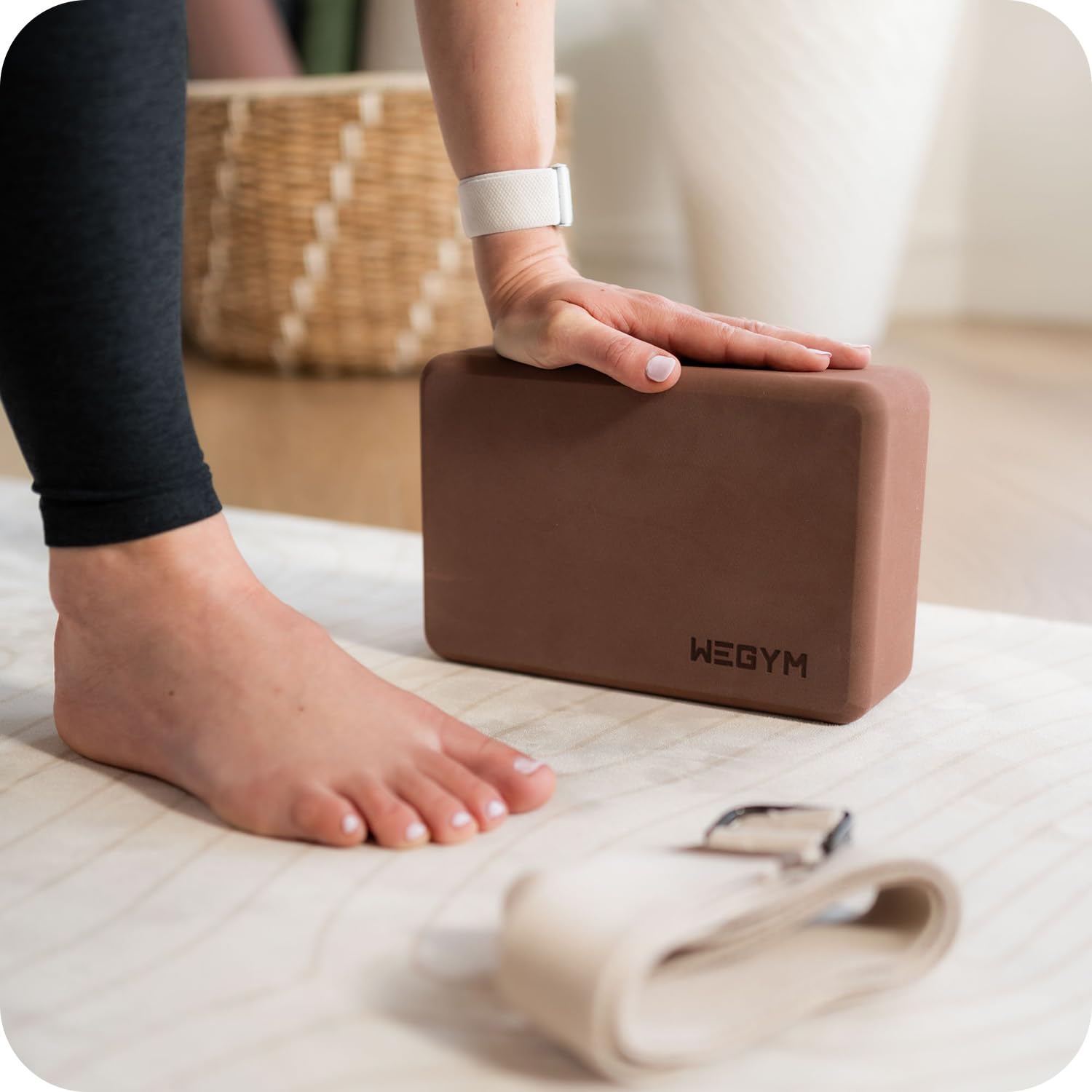 WeGym block in use under yoga hands demonstrating improved alignment