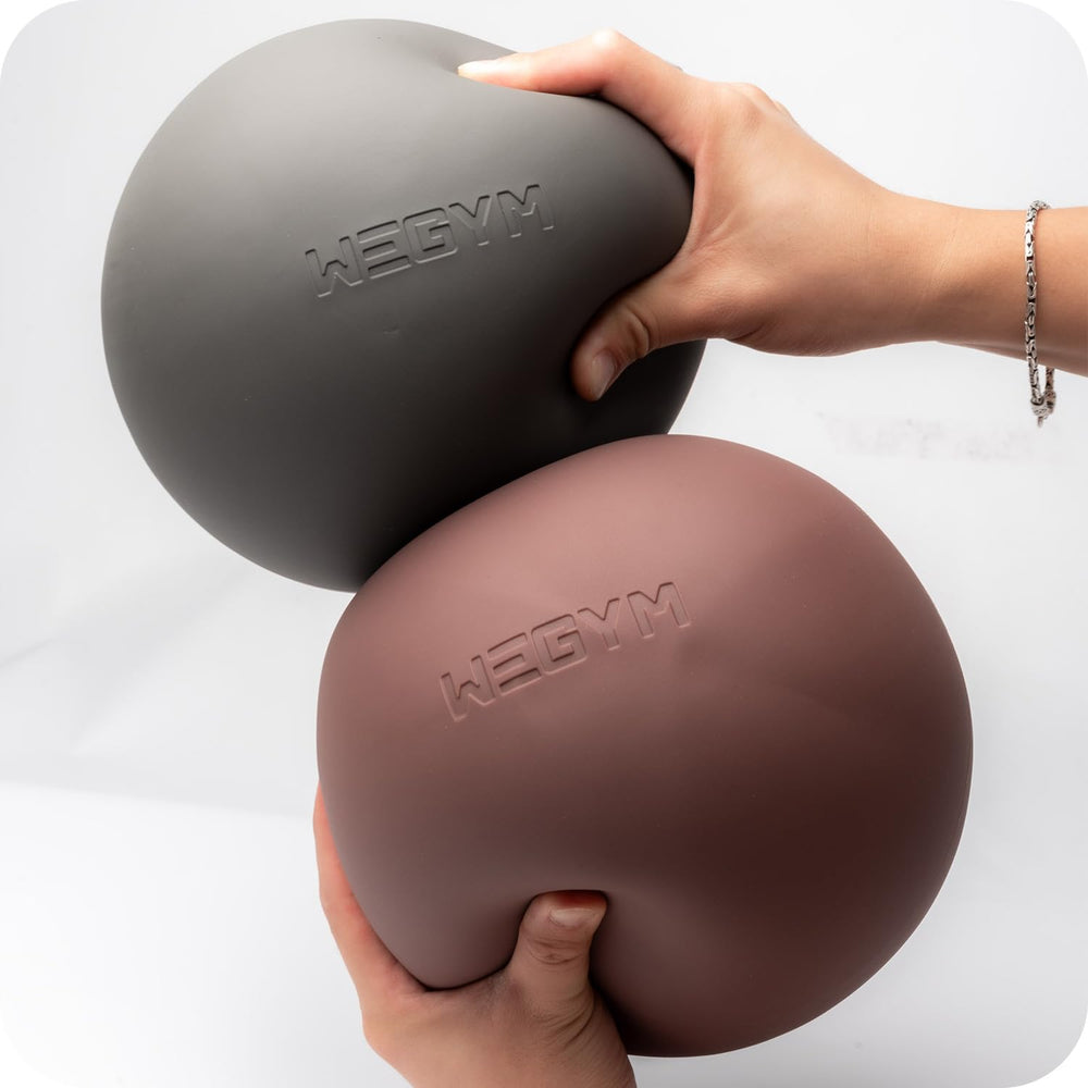 WeGym pilates ball next to hand shows 7.87-inch scale for travel convenience