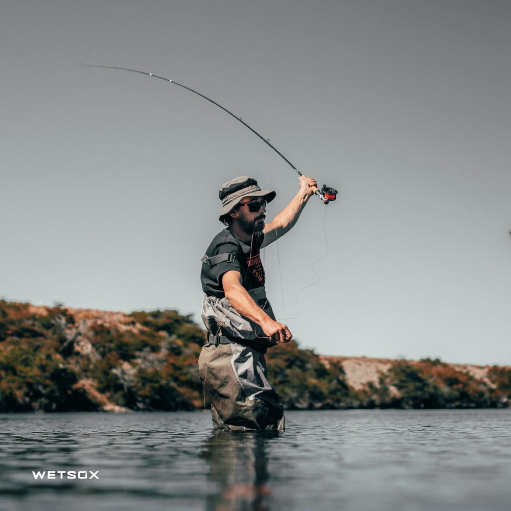 Wetsox sock in use as foot slides easily into wader demonstrating frictionless entry