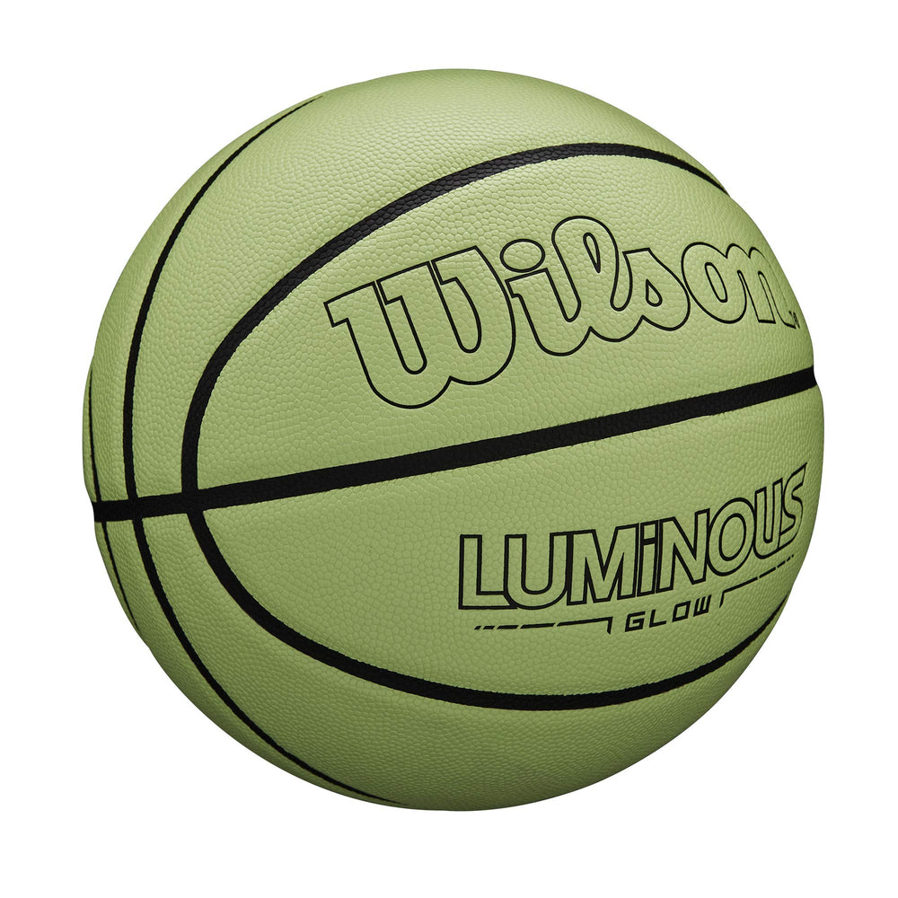 Wilson ball on outdoor court at dusk illustrating glow visibility and extended playtime benefit