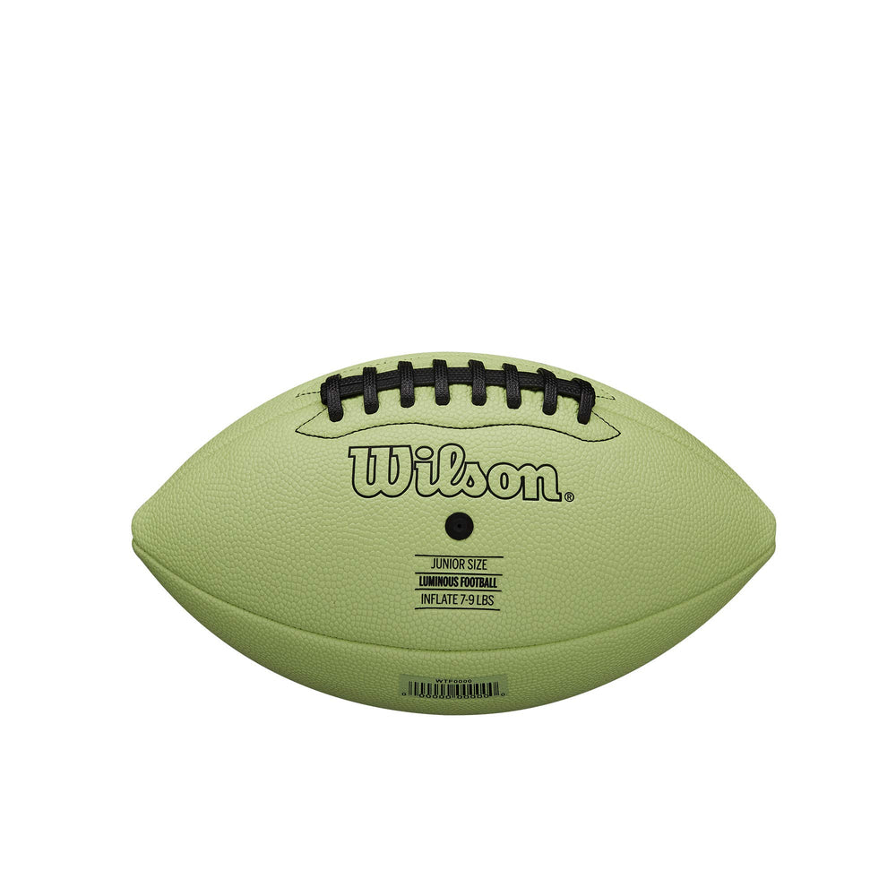 WILSON football being kicked on grass illustrating durable play and shape retention
