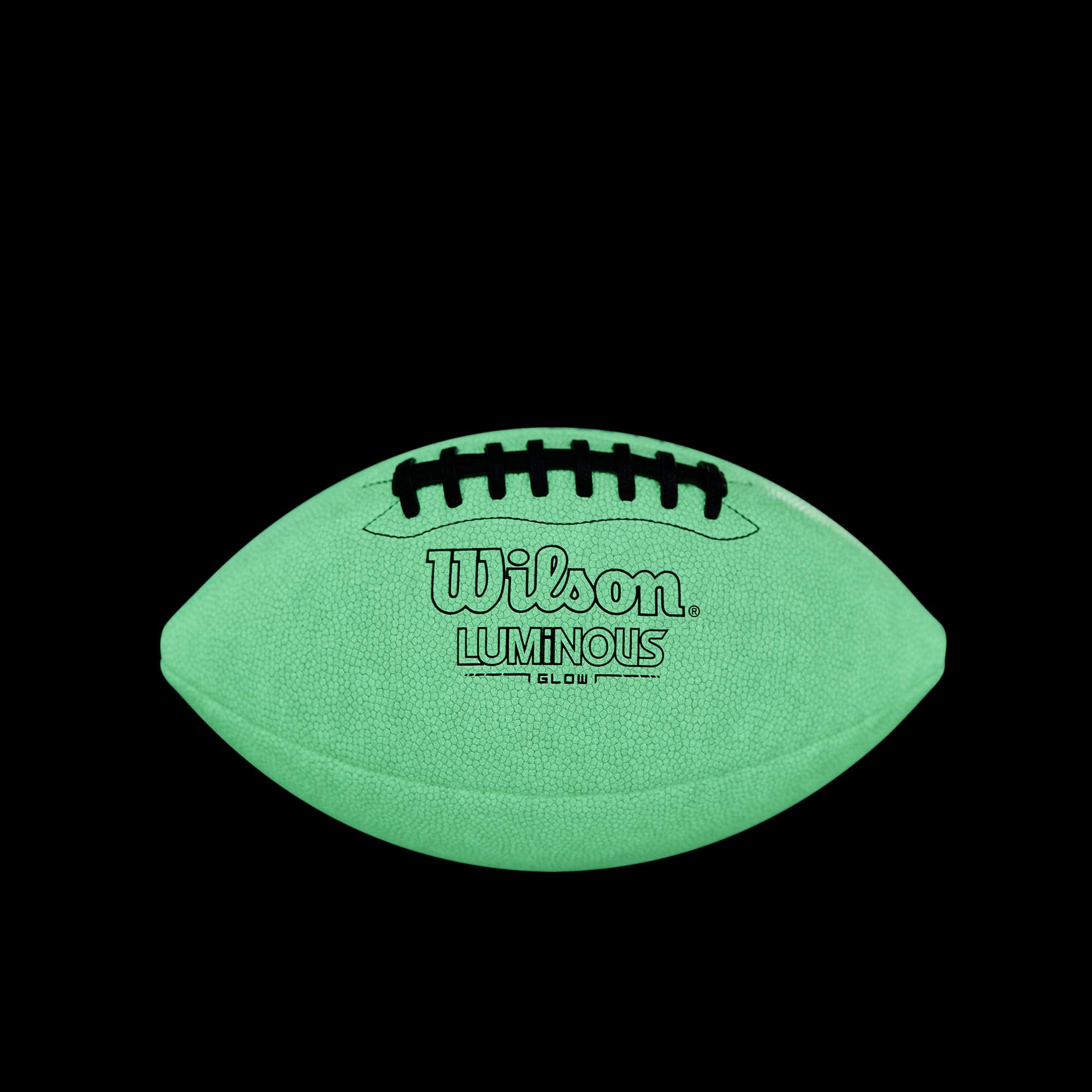WILSON football lit with a phone flashlight to create custom glow patterns