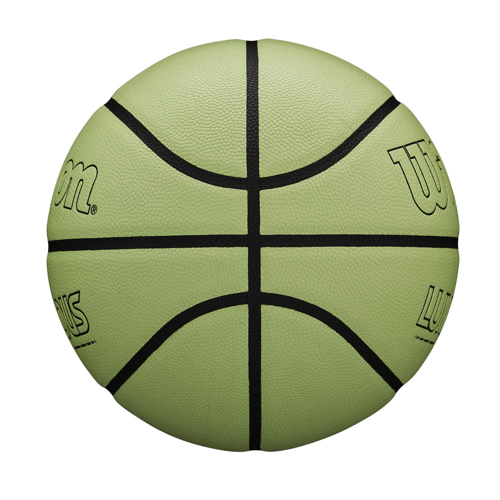 Wilson ball being lit by phone flashlight demonstrating instant glow activation for nighttime play