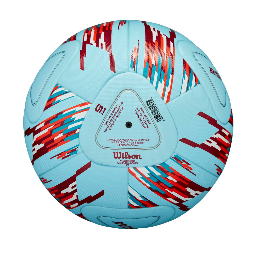 WILSON Vanquish on stadium turf in evening light showing high visibility for games