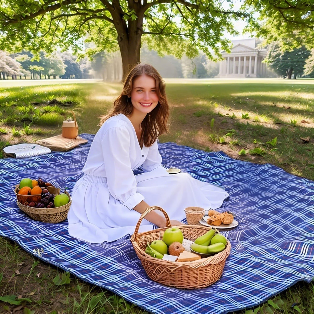 Wind Tour picnic blanket in use at beach with family illustrating spacious comfort
