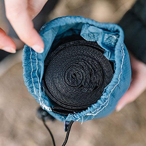 Wise Owl Outfitters hammock set up on sandy beach for relaxing travel use
