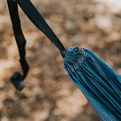 Wise Owl Outfitters hammock hung between trees at campsite for restful lounging