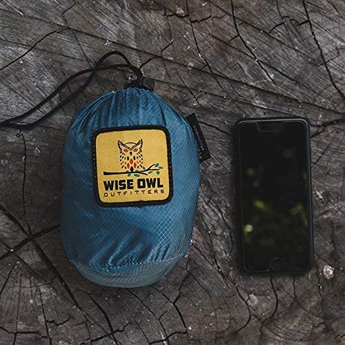 Wise Owl Outfitters packed hammock next to a water bottle showing grapefruit-size packability
