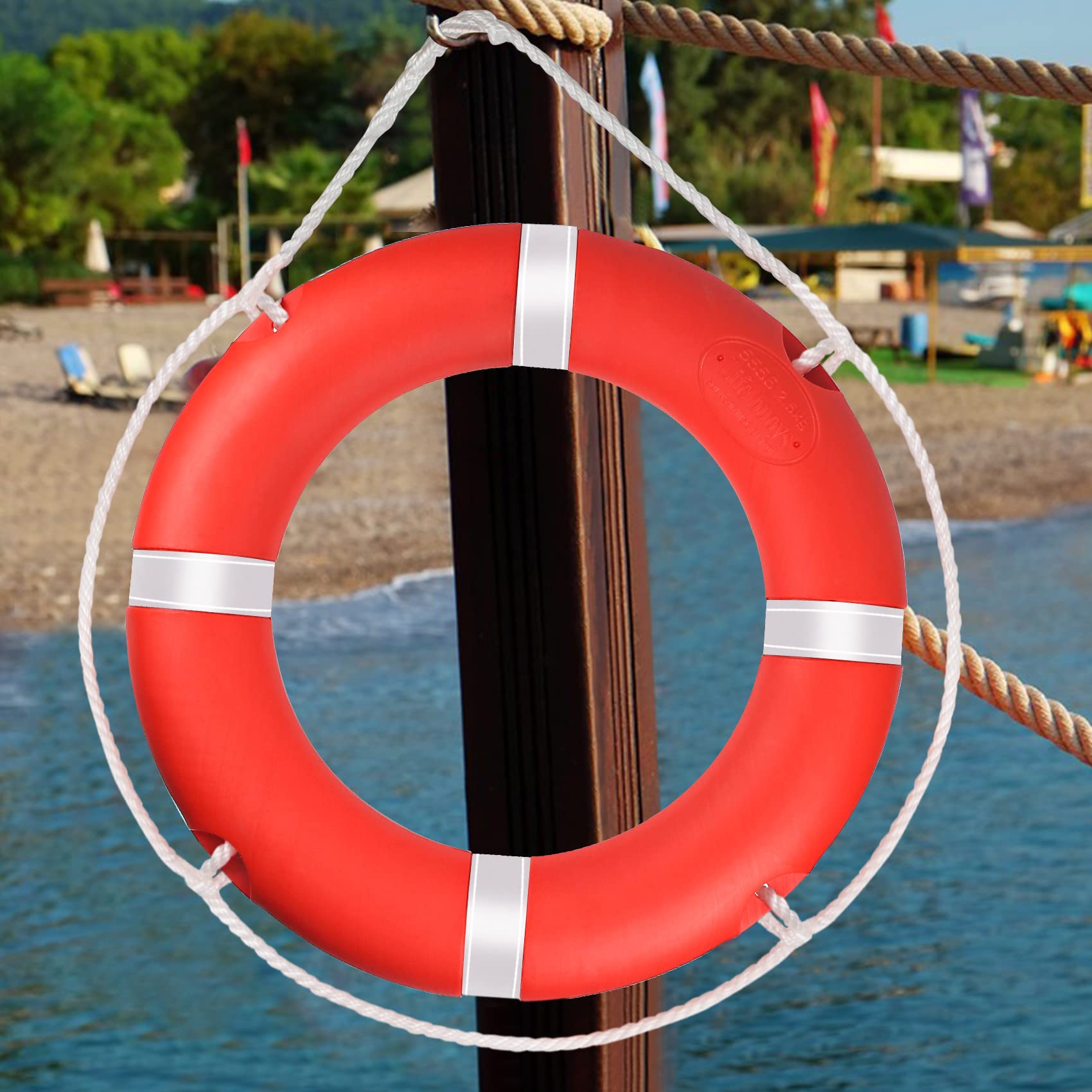 WTMORE life ring next to ruler showing 23-inch diameter for scale and sizing
